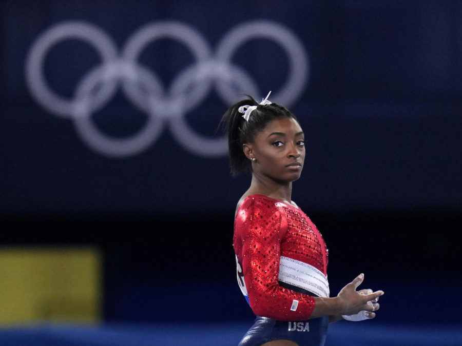 File-This July 27, 2021, file photo shows Simone Biles, of the United States, waiting to perform on the vault during the artistic gymnastics womens final at the 2020 Summer Olympics, Tuesday, July 27, 2021, in Tokyo. Biles’ sponsors including Athleta and Visa are lauding her decision to put her mental health first and withdraw from the gymnastics team competition during the Olympics. It’s the latest example of sponsors praising athletes who are increasingly open about mental health issues. (AP Photo/Gregory Bull, File)