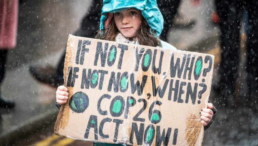 A child taking part in a rally that was protesting the lack of action being taken against global warming